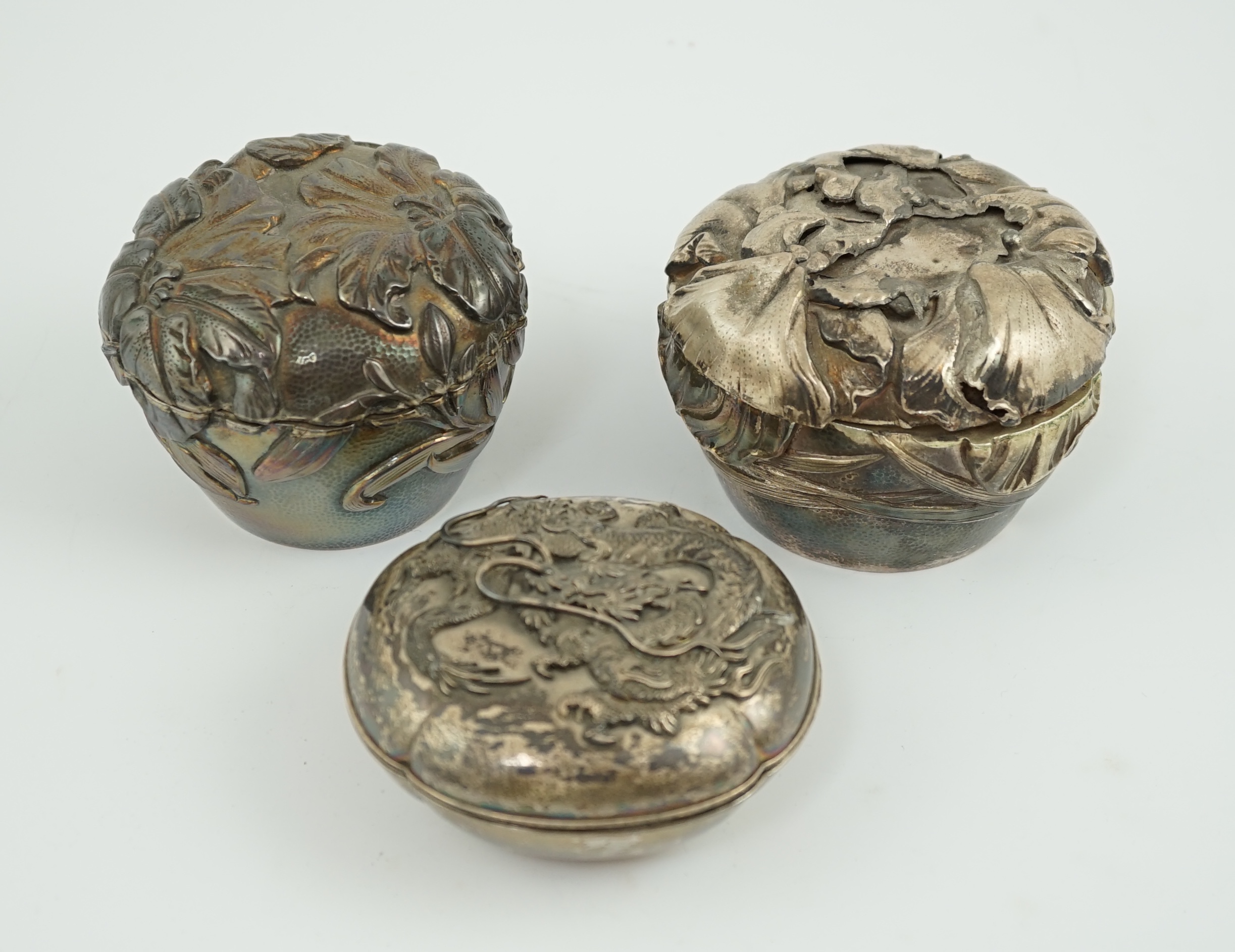 Three assorted early 20th century Japanese silver boxes with covers